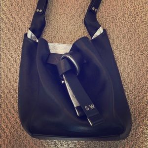 Stuart weitzman the twist drawstring bag small